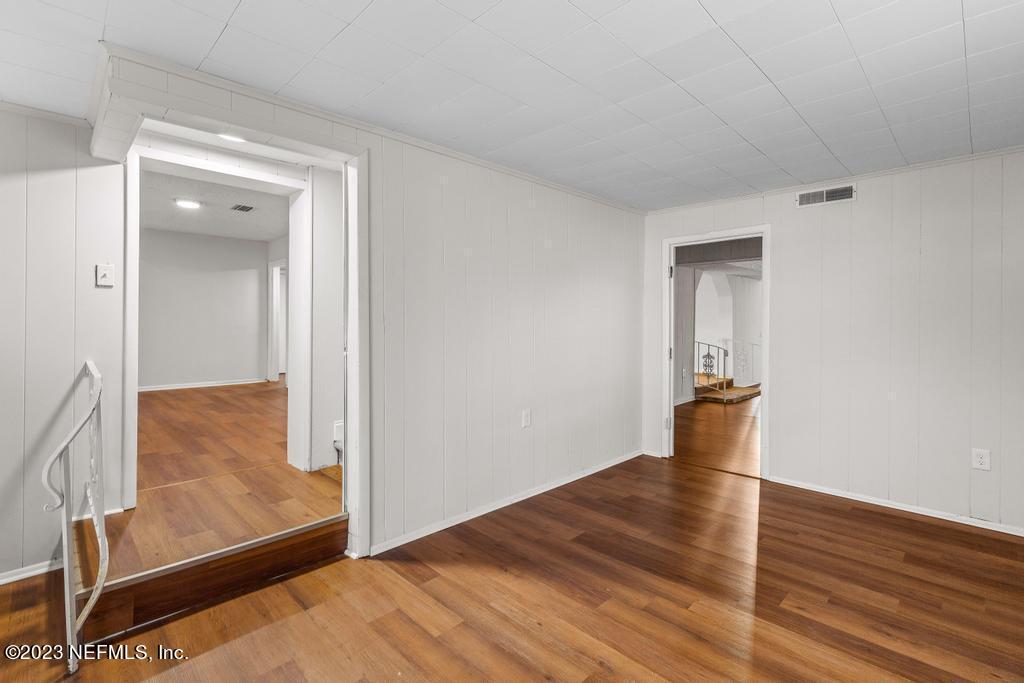 3616 Freeman Road Jacksonville, FL 32207 - Photo 17 of 41 a view of an empty room and wooden floor