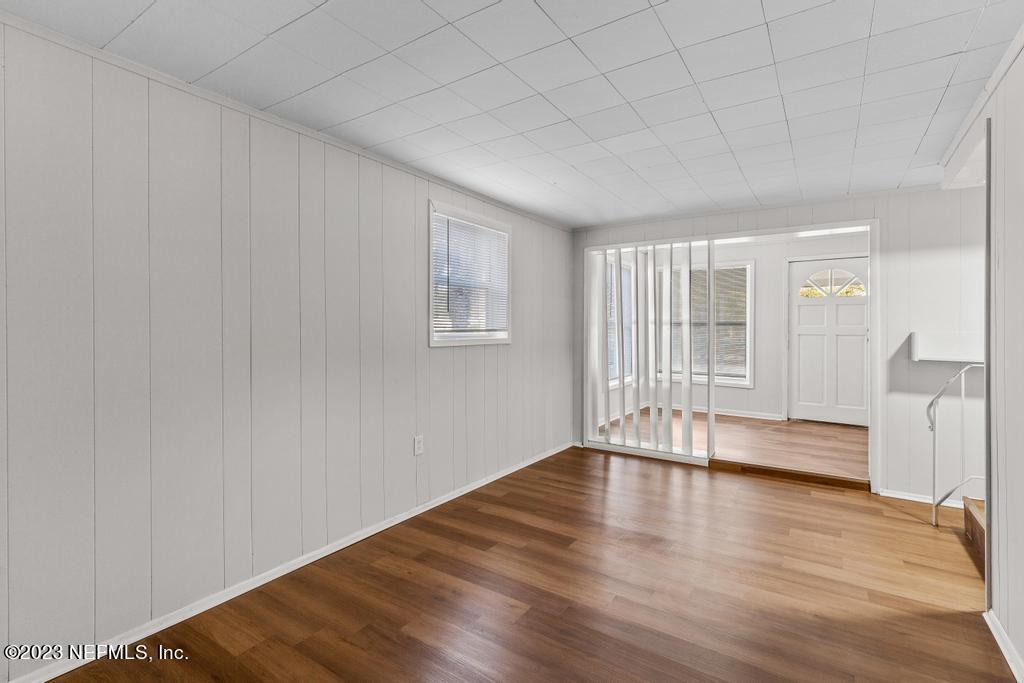 3616 Freeman Road Jacksonville, FL 32207 - Photo 18 of 41 a view of empty room with wooden floor and fan