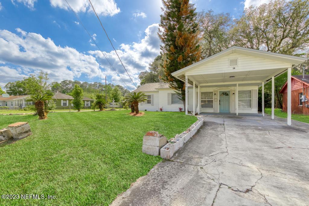 3616 Freeman Road Jacksonville, FL 32207 - Photo 2 of 41 a front view of a house with a yard