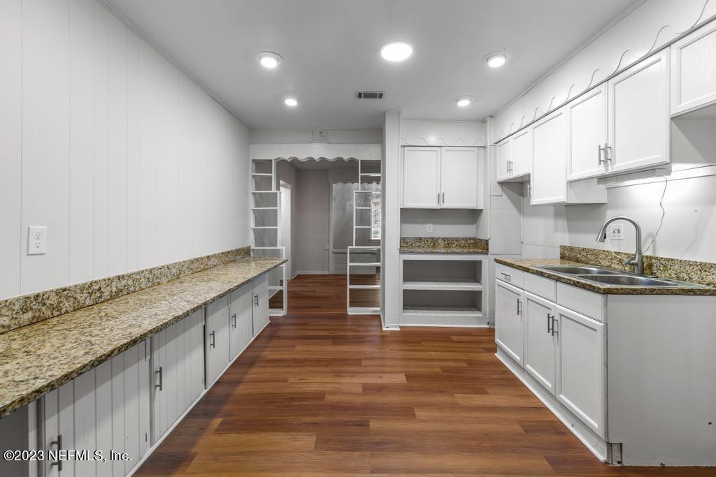3616 Freeman Road Jacksonville, FL 32207 - Photo 25 of 41 a large kitchen with kitchen island a sink stainless steel appliances and cabinets