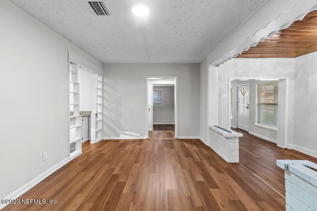 3616 Freeman Road Jacksonville, FL 32207 - Photo 28 of 41 wooden floor in an empty room with a window