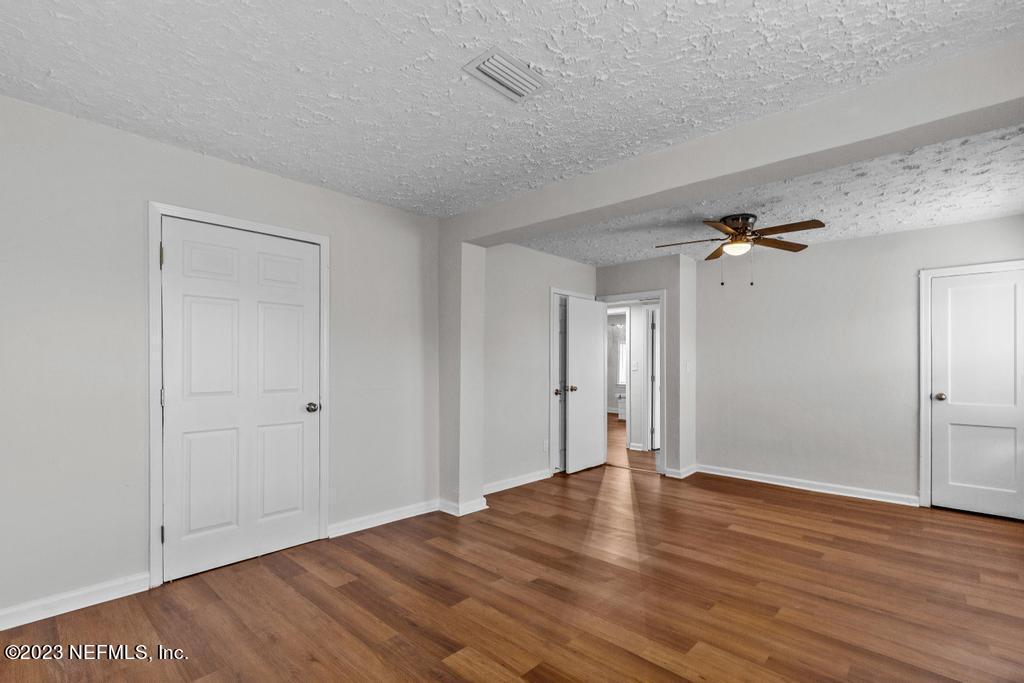 3616 Freeman Road Jacksonville, FL 32207 - Photo 31 of 41 a view of an empty room with wooden floor
