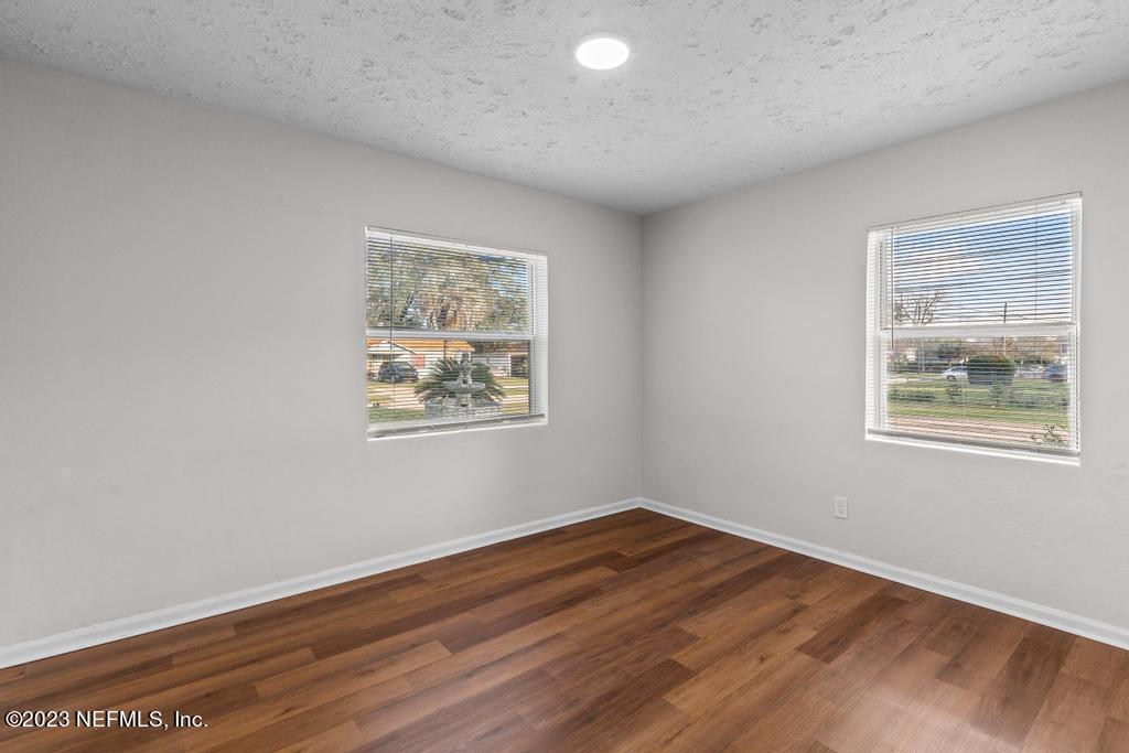 3616 Freeman Road Jacksonville, FL 32207 - Photo 32 of 41 a view of room with window and wooden floor