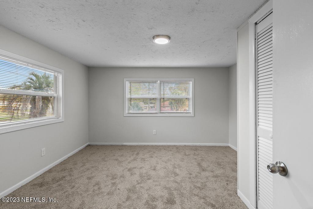 3616 Freeman Road Jacksonville, FL 32207 - Photo 33 of 41 an empty room with windows