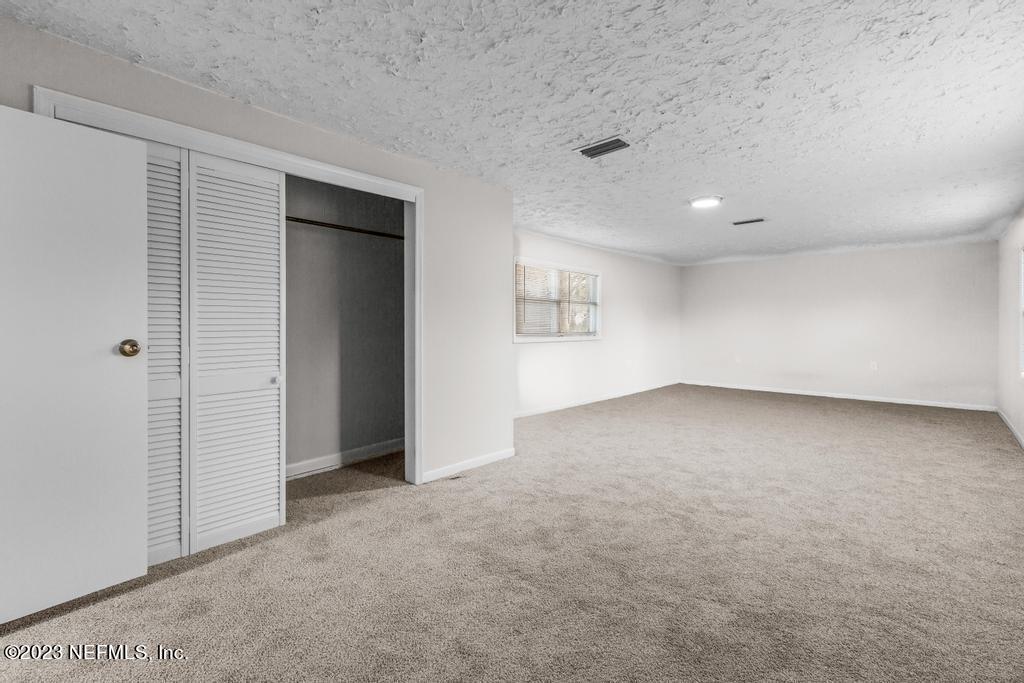3616 Freeman Road Jacksonville, FL 32207 - Photo 39 of 41 an empty room with a empty space and windows