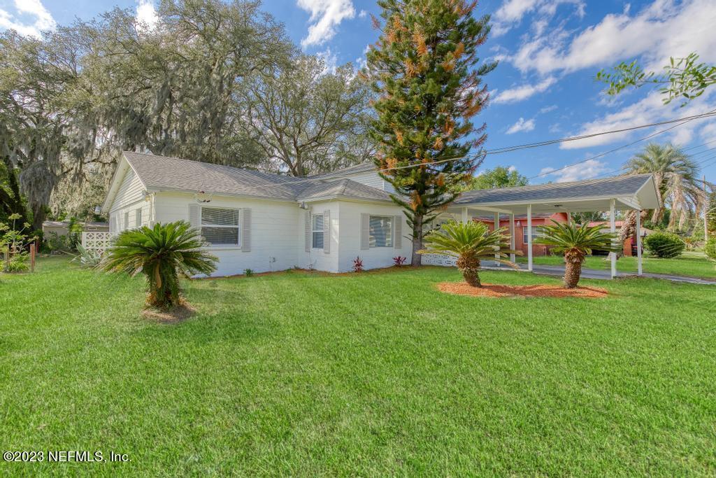 3616 Freeman Road Jacksonville, FL 32207 - Photo 4 of 41 a view of house with a big yard and large trees