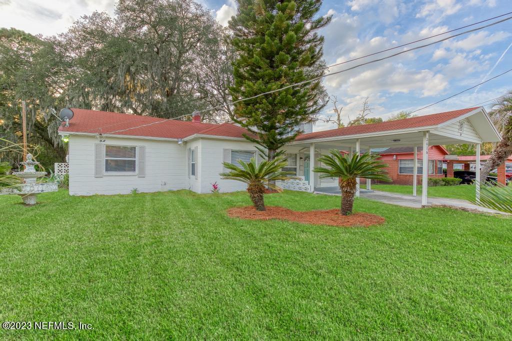 3616 Freeman Road Jacksonville, FL 32207 - Photo 9 of 41 a view of a house with a yard and tree s