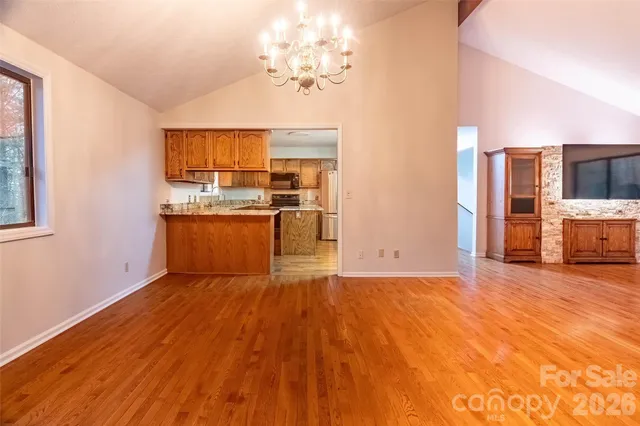 a view of a kitchen with a stove cabinets and wooden floor