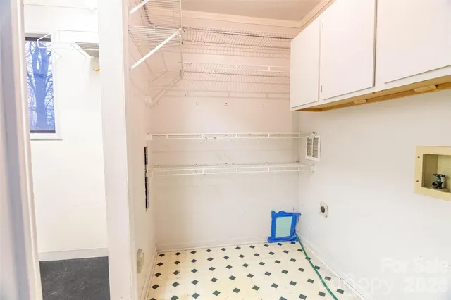 a view of a room with wooden walls