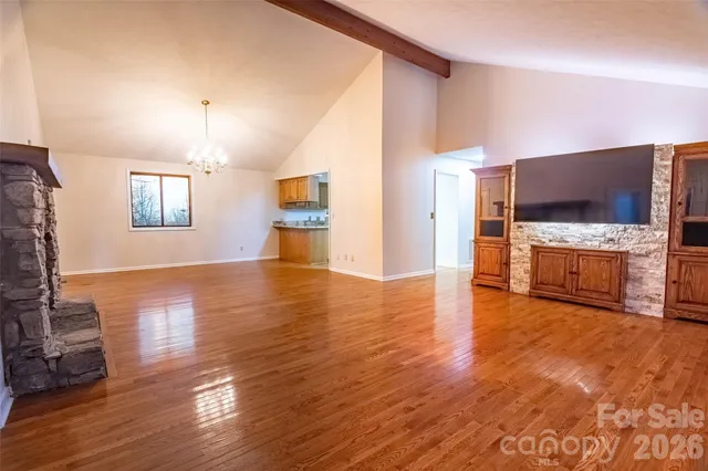 a view of a living room with furniture and a flat screen tv