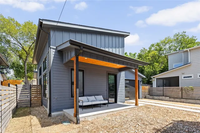 a backyard of a house with seating space