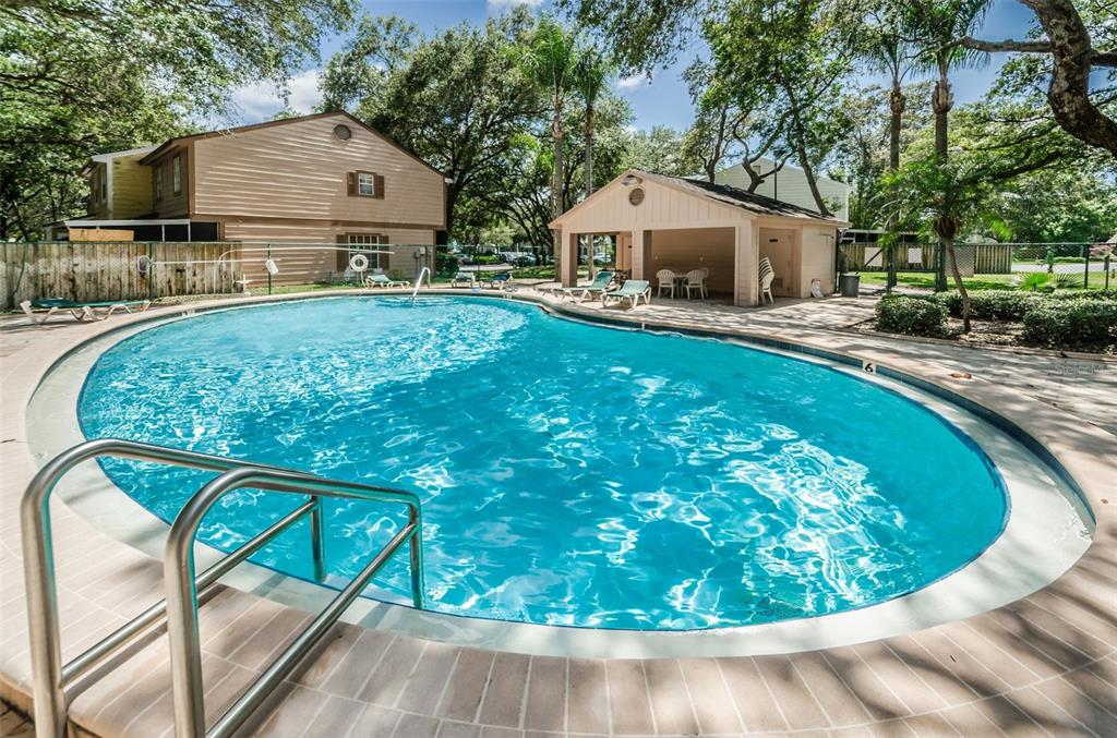 1481 Cairn Court Palm Harbor, FL 34683 - Photo 38 of 40 a view of a house with backyard porch and sitting area