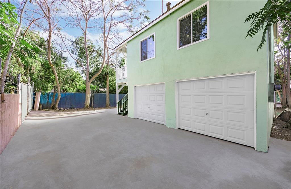 3050 Lime Street Riverside, CA 92501 - Photo 15 of 35 a view of a house with a garage
