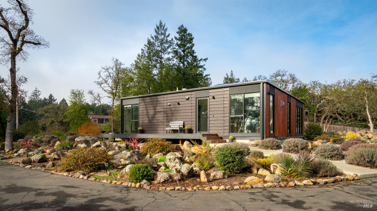 2789 Bardy Road Santa Rosa, CA 95404 - Photo 26 of 32 a backyard of a house with large trees and outdoor seating