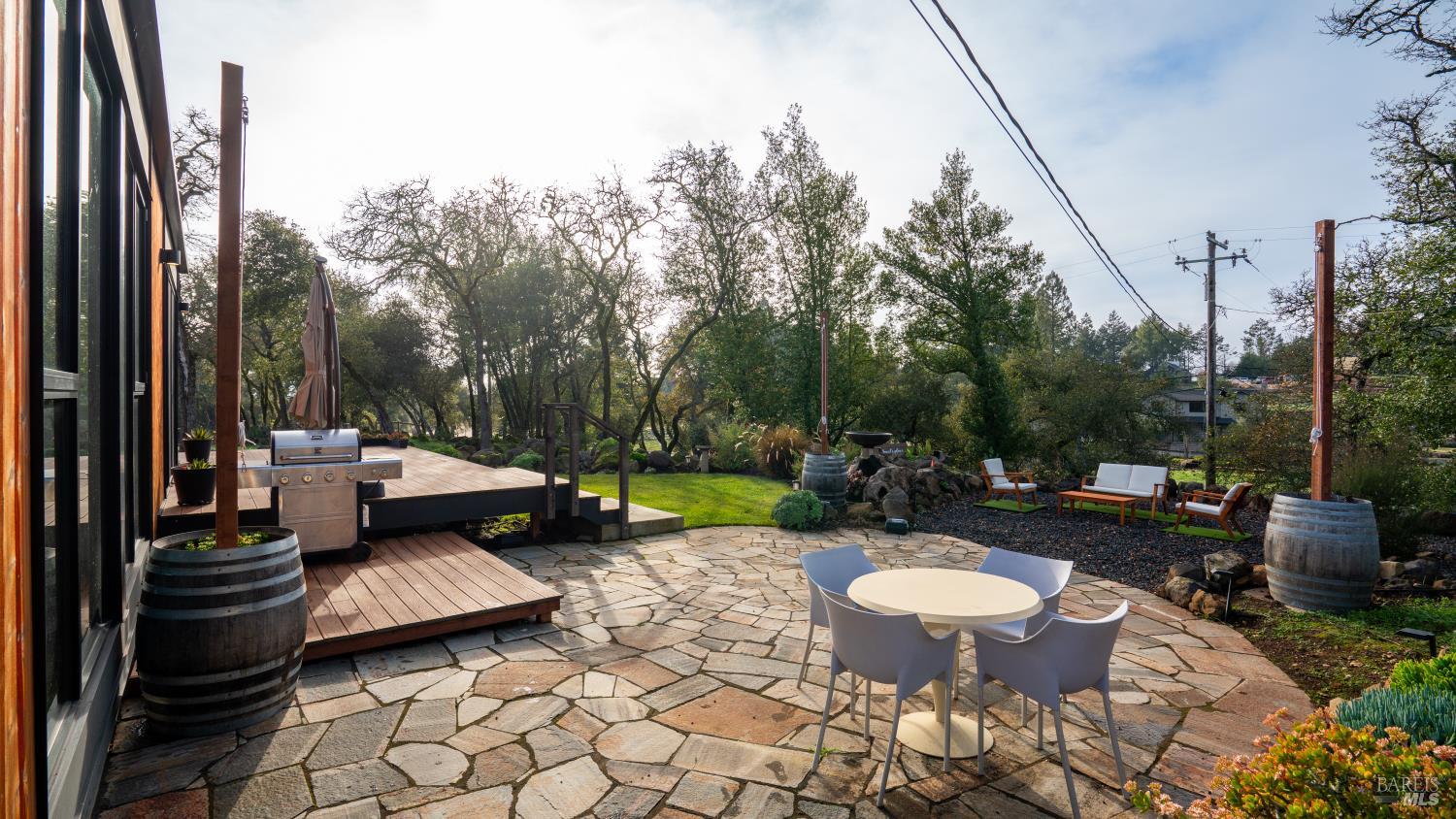 2789 Bardy Road Santa Rosa, CA 95404 - Photo 30 of 32 a view of a patio with table and chairs couches with wooden fence