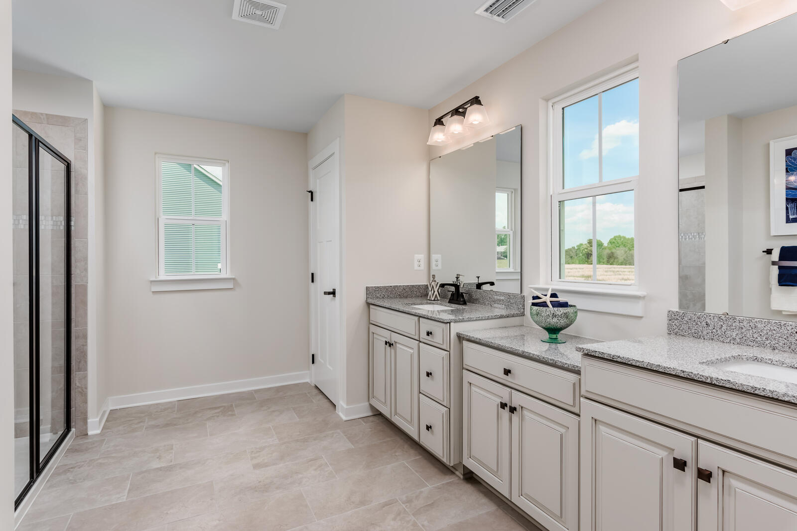 7236 Fairway Rdg Circle Salem, VA 24153 - Photo 11 of 26 a bathroom with double sink large mirror and a window