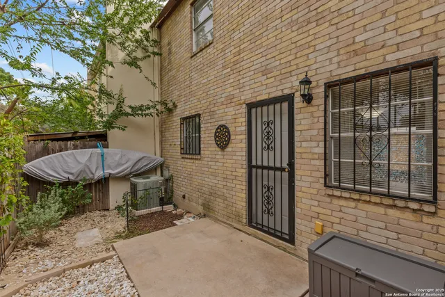 a view of a patio in backyard