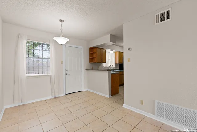 a view of a kitchen with a sink