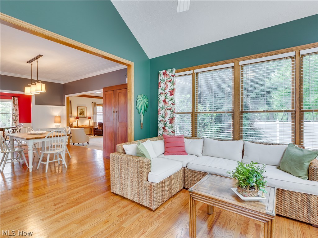 876 Hunter Ridge Circle Fairlawn, OH 44333 - Photo 8 of 35 Hardwood floors, vaulted ceiling and walls of windows make this sunroom cheery everyday