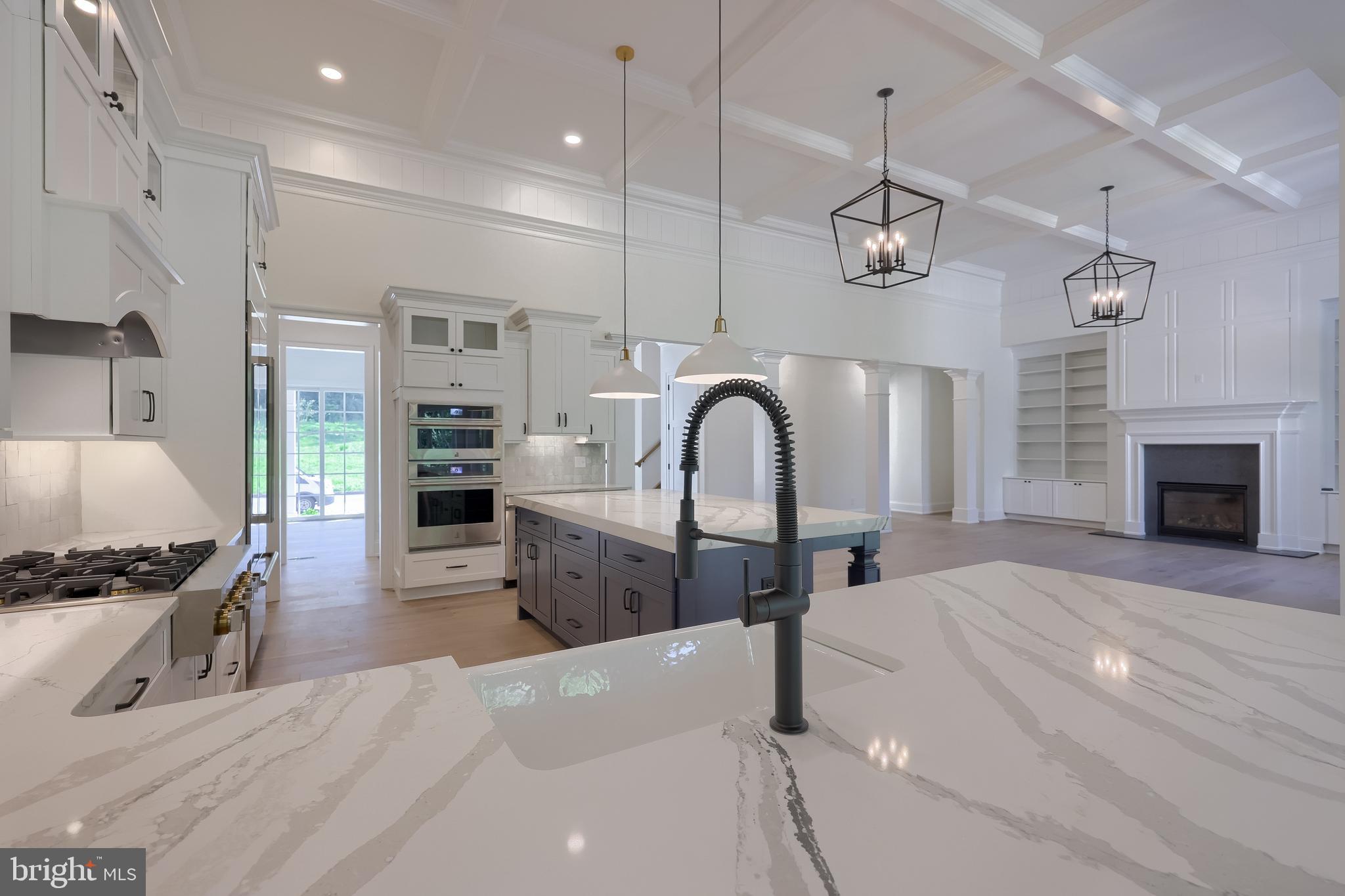 421 Southampton Drive Lititz, PA 17543 - Photo 11 of 49 a large kitchen with stainless steel appliances kitchen island granite countertop a stove a sink a refrigerator and a wooden floors