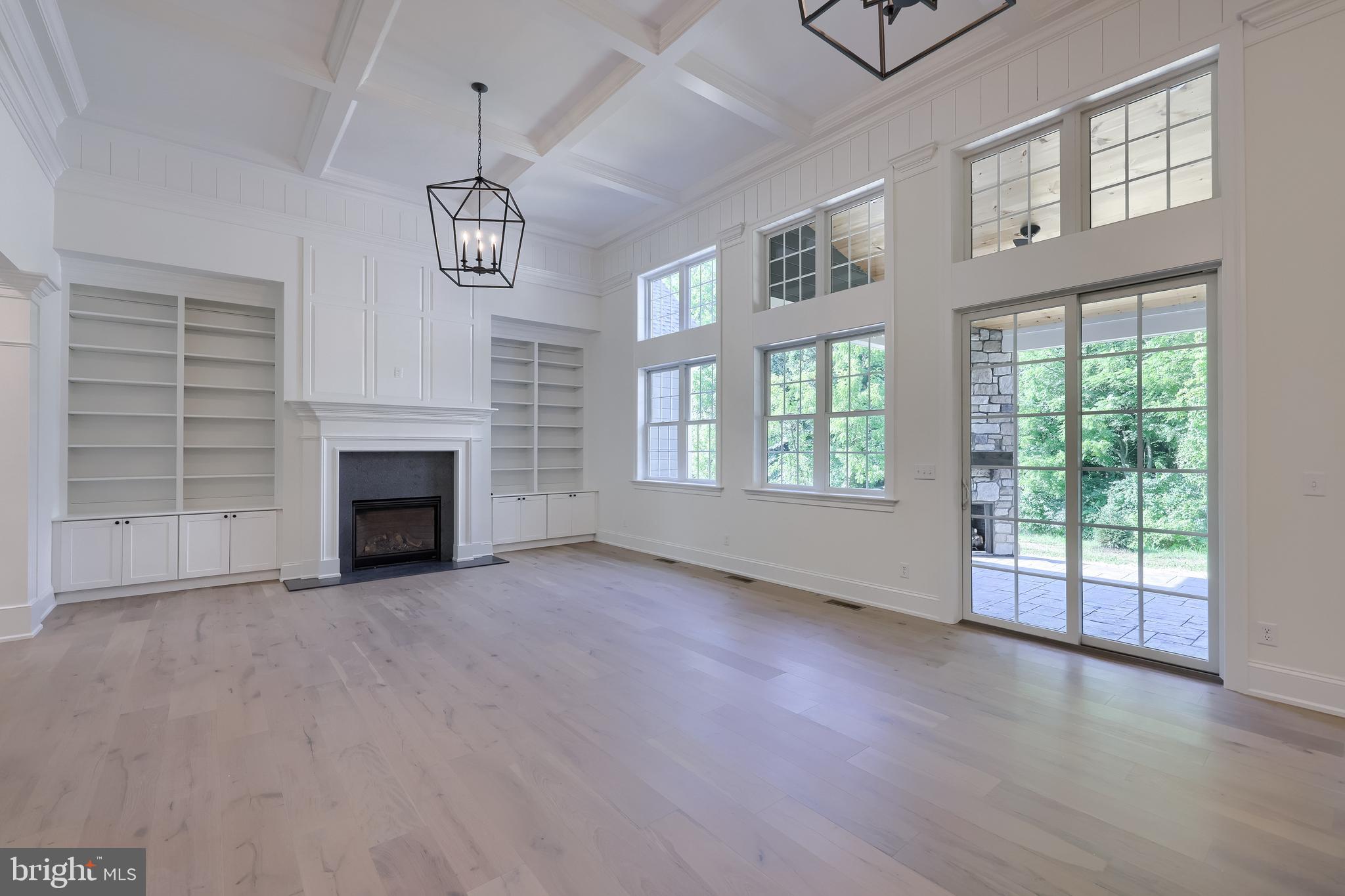 421 Southampton Drive Lititz, PA 17543 - Photo 22 of 49 an empty room with windows fireplace and windows