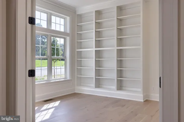 a view of an empty room with a window