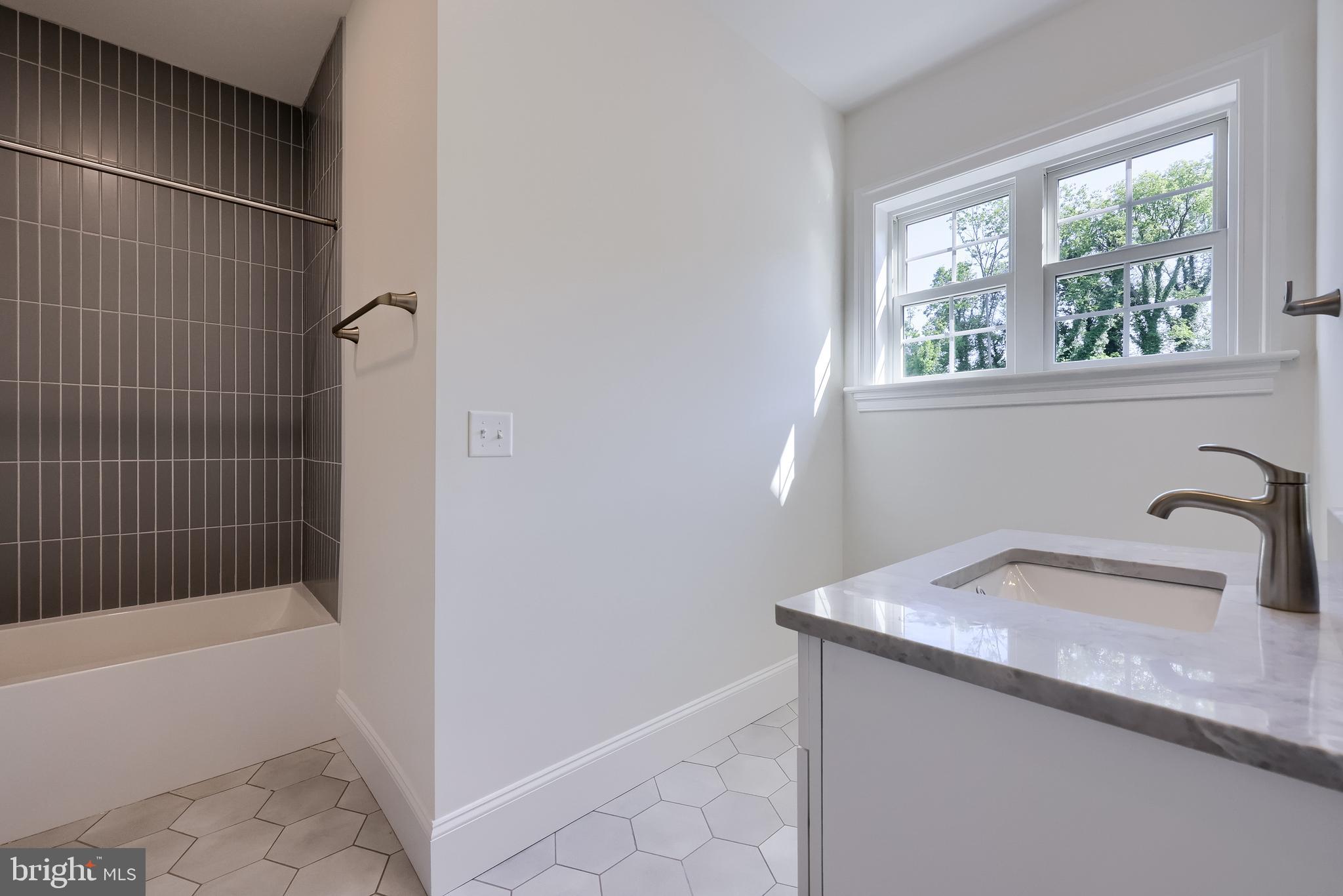 421 Southampton Drive Lititz, PA 17543 - Photo 38 of 49 a bathroom with a granite countertop sink a toilet and bathtub