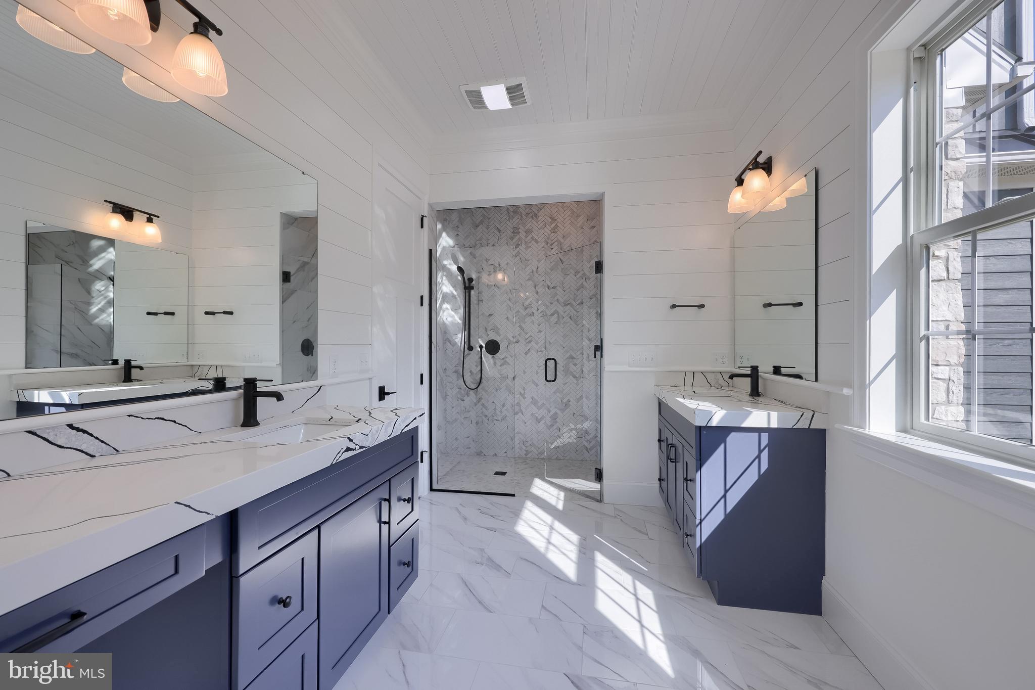 421 Southampton Drive Lititz, PA 17543 - Photo 44 of 49 a spacious bathroom with a granite countertop sink mirror and shower