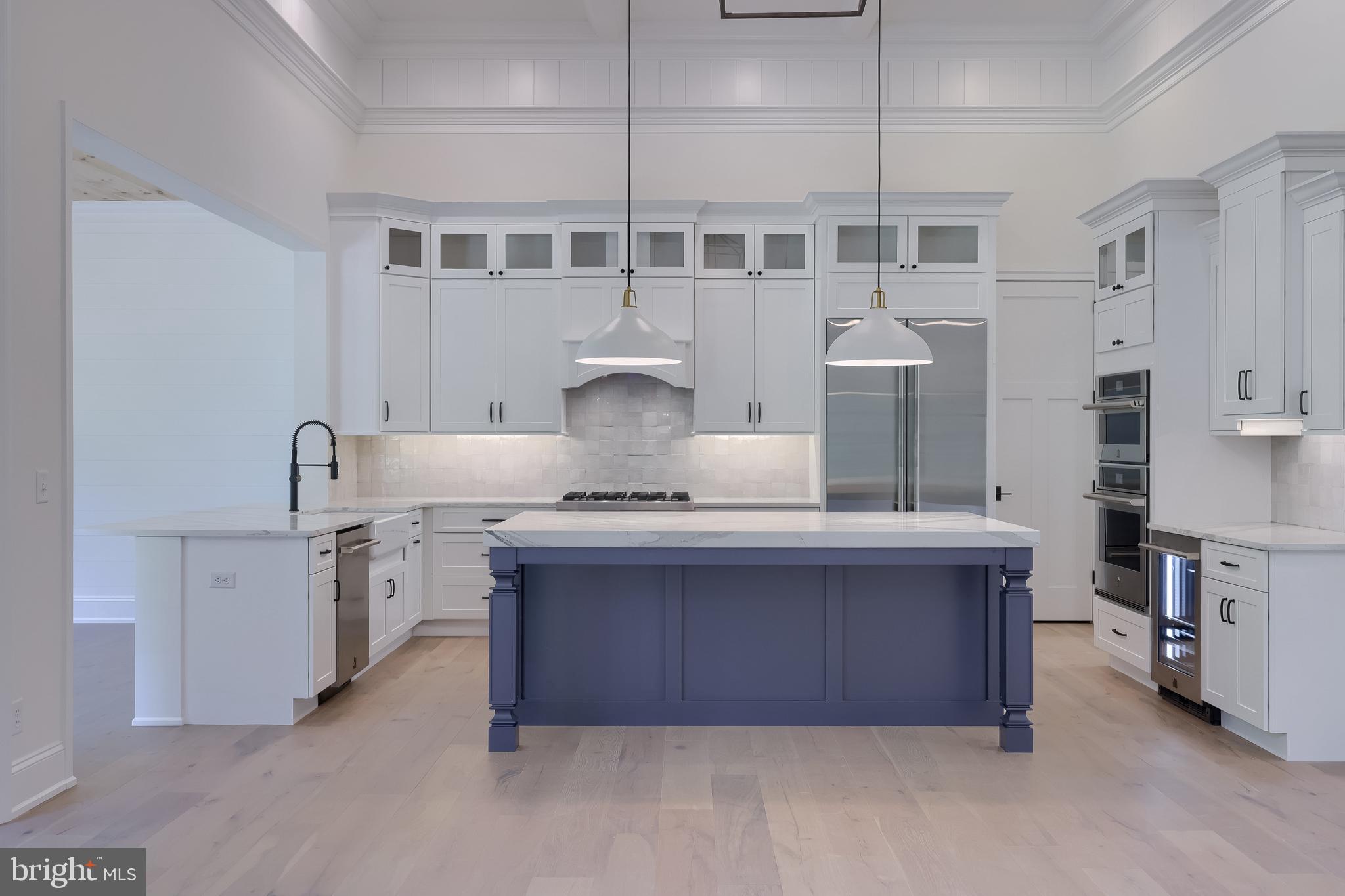 421 Southampton Drive Lititz, PA 17543 - Photo 6 of 49 a kitchen with kitchen island granite countertop a sink and a stove