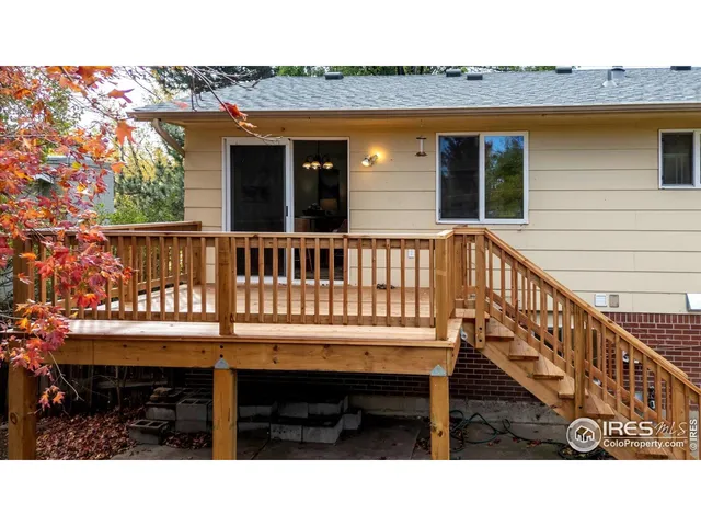 a balcony with table and chairs