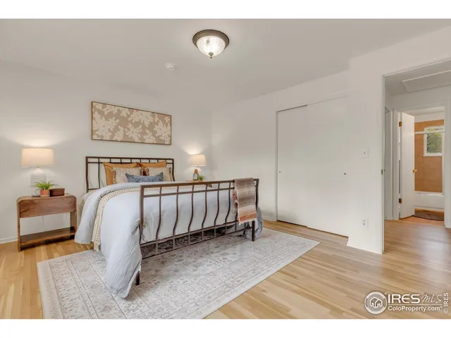 a bedroom with a bed and a walk in closet