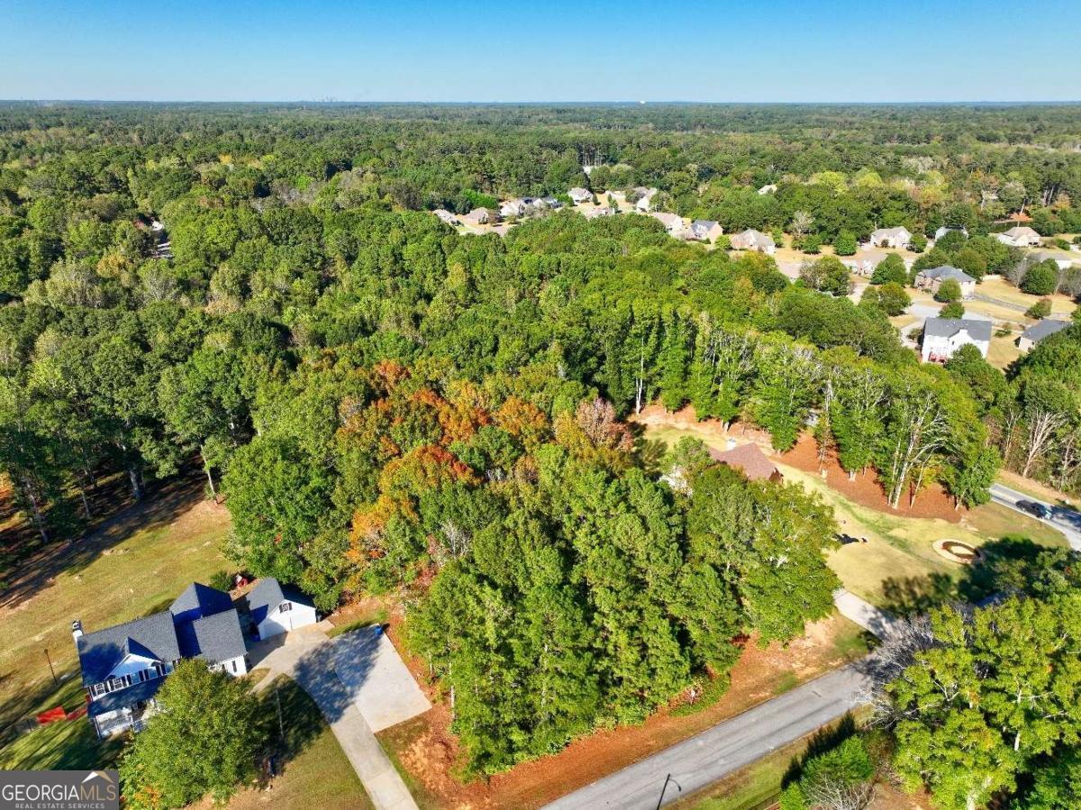 811 Hood Road Fayetteville, GA 30214 - Photo 7 of 15 an aerial view of residential houses with outdoor space and trees