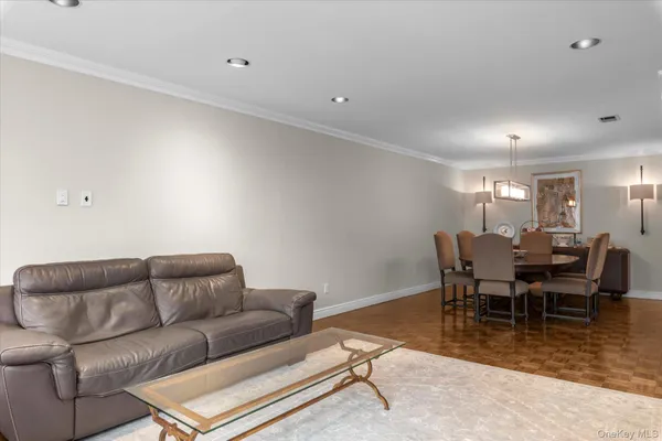 a view of a dining room with furniture and window