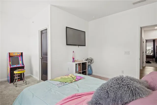 a bedroom with a bed and a closet