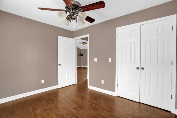 a view of a kitchen counter space and wooden floor