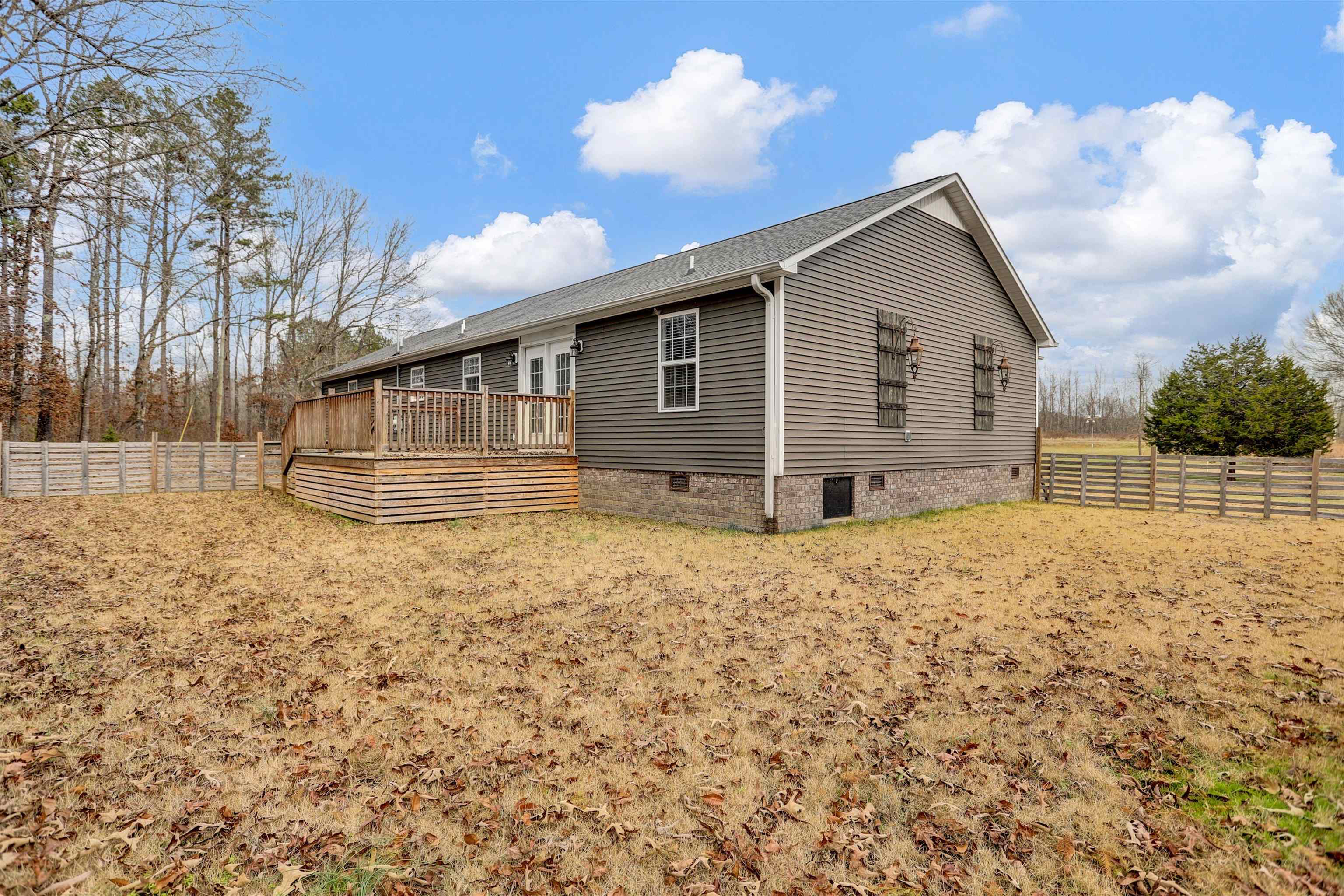 186 King Road Selmer, TN 38375 - Photo 27 of 30 a backyard of a house with table and chairs