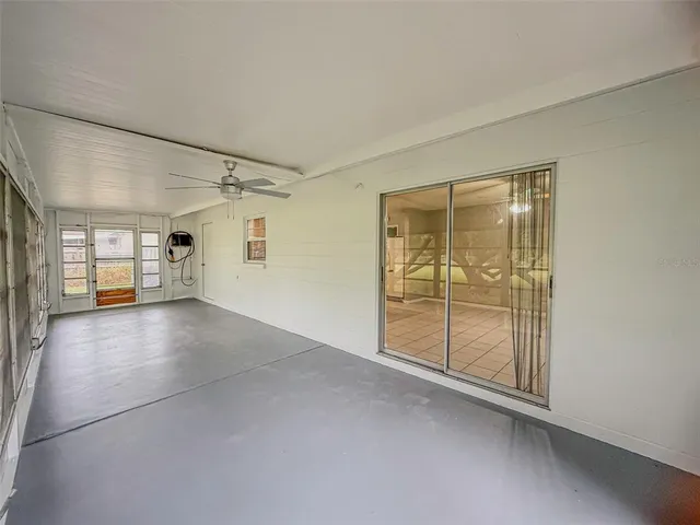 a view of empty room with wooden floor and cabinet