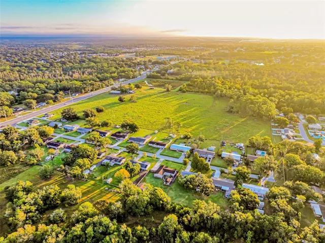 an aerial view of residential building and ocean