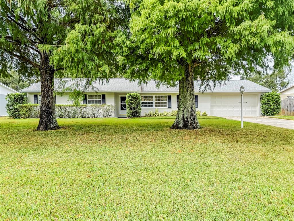 6428 Tula Lane Lakeland, FL 33809 - Photo 3 of 29 a front view of a house with garden