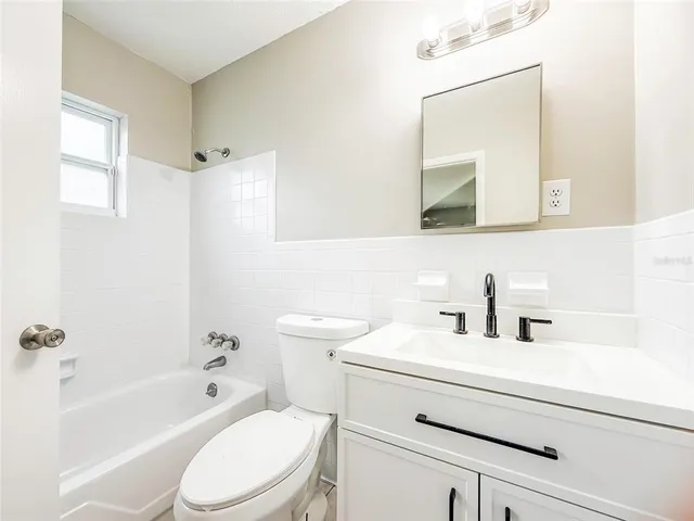 a bathroom with a sink a toilet and a bathtub