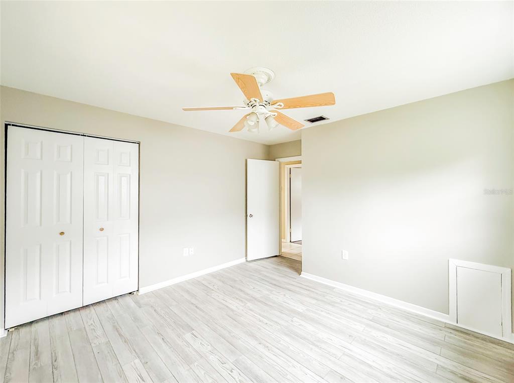 6428 Tula Lane Lakeland, FL 33809 - Photo 9 of 29 a view of a livingroom with wooden floor and a ceiling fan