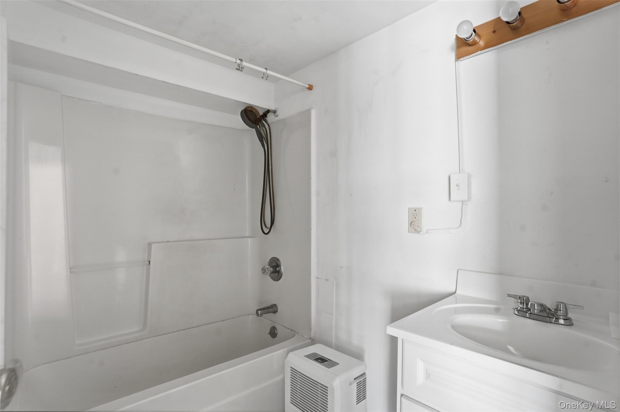 6 Short Road Wurtsboro, NY 12790 - Photo 35 of 48 a bathroom with a sink a mirror toilet and bathtub