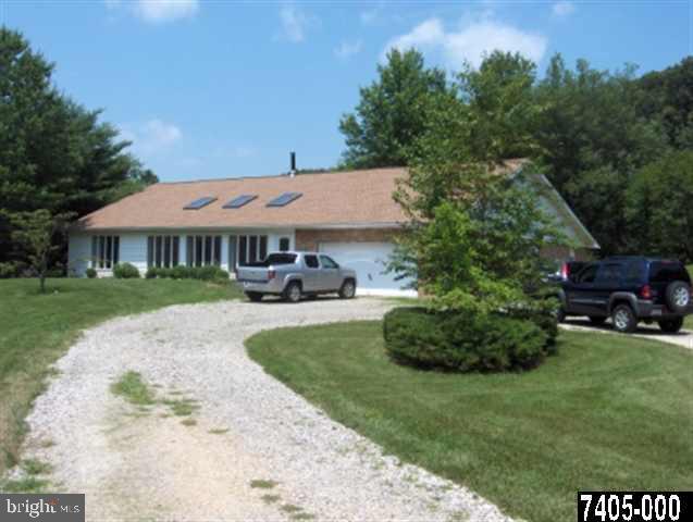 5713 Senft Road Spring Grove, PA 17362 - Photo 1 of 1 a front view of a house with a garden