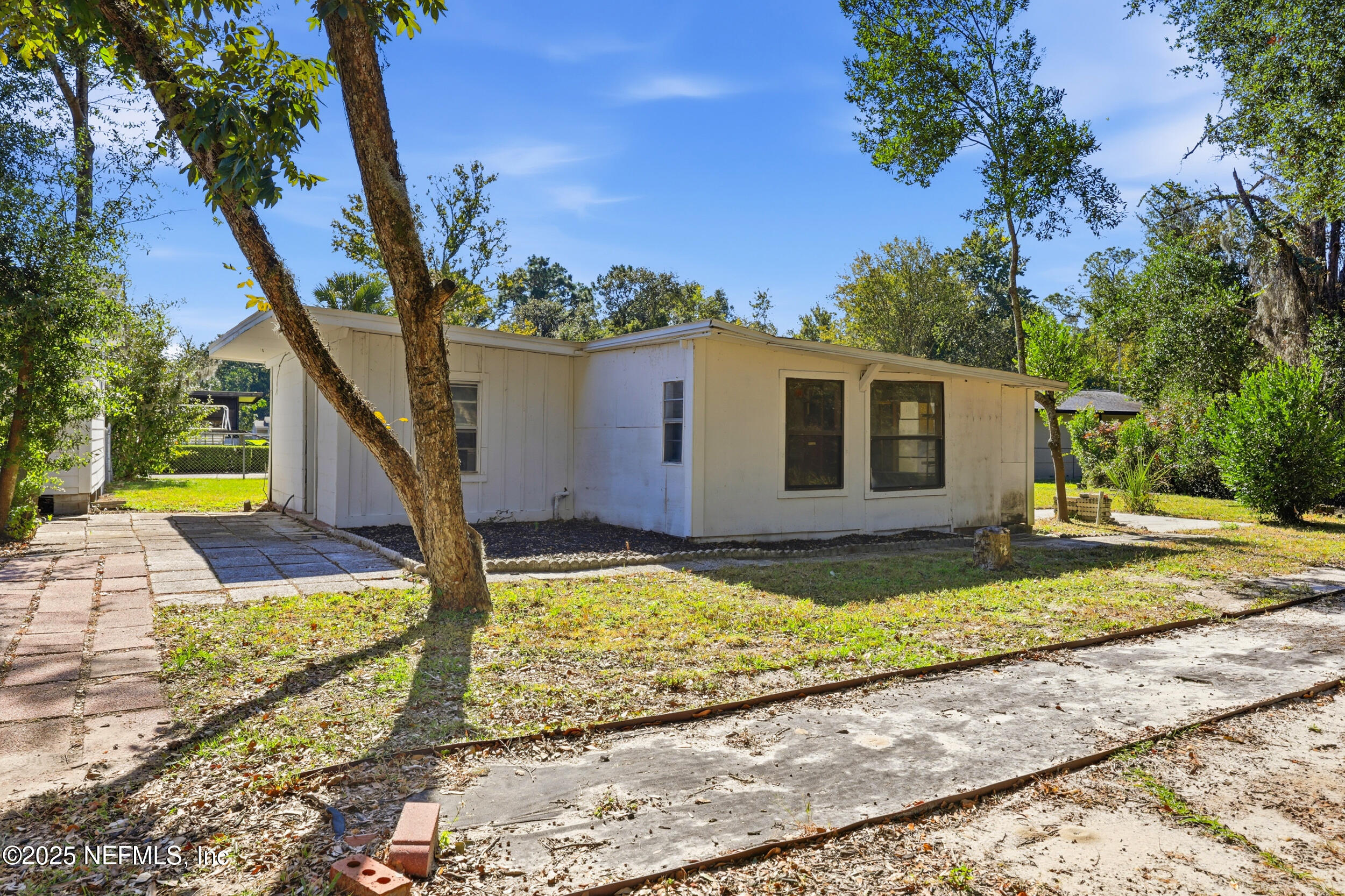 2236 Anniston Road Jacksonville, FL 32246 - Photo 20 of 27 a view of a house with backyard and trees