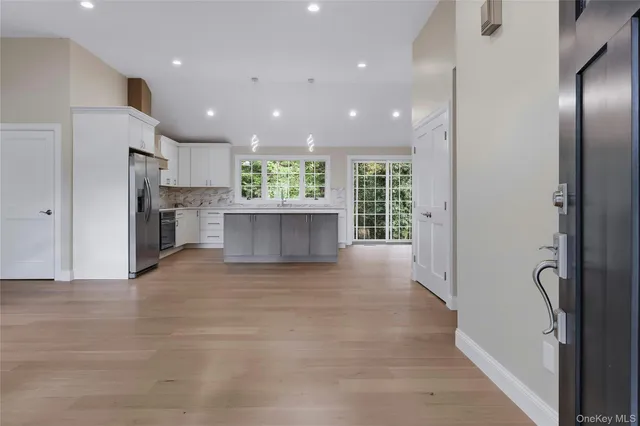 a view of kitchen with furniture and wooden floor