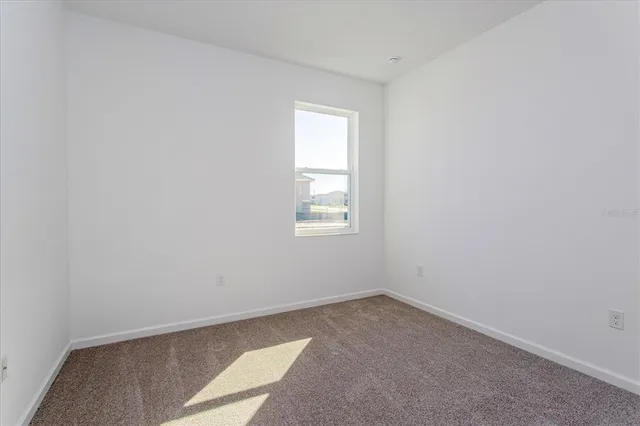 a bathroom with a granite countertop sink toilet a mirror and shower