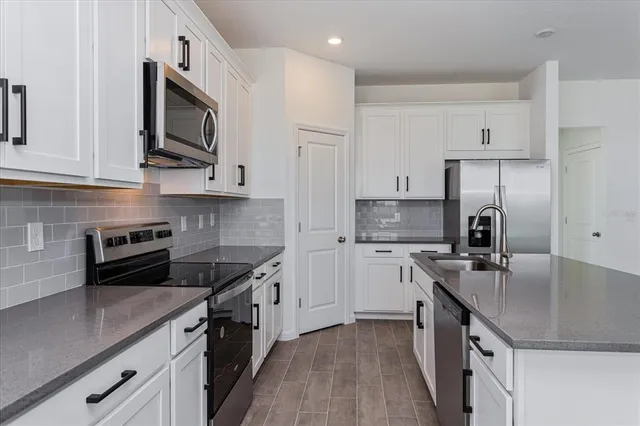 a view of an entryway with wooden floor and windows