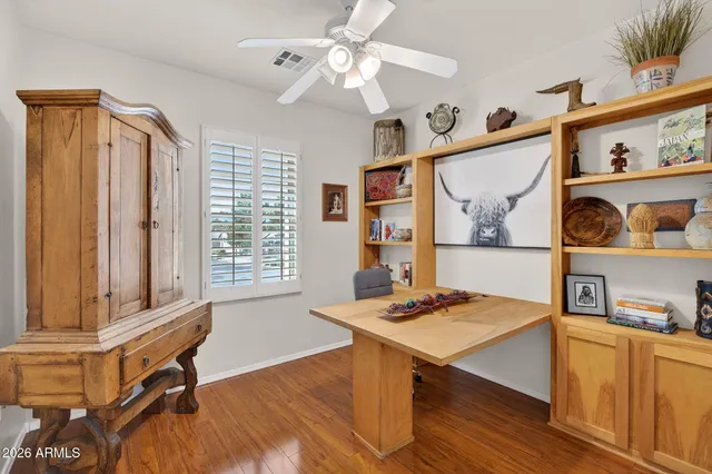 a workspace with furniture and window