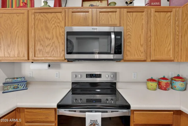a stove top oven sitting inside of a kitchen