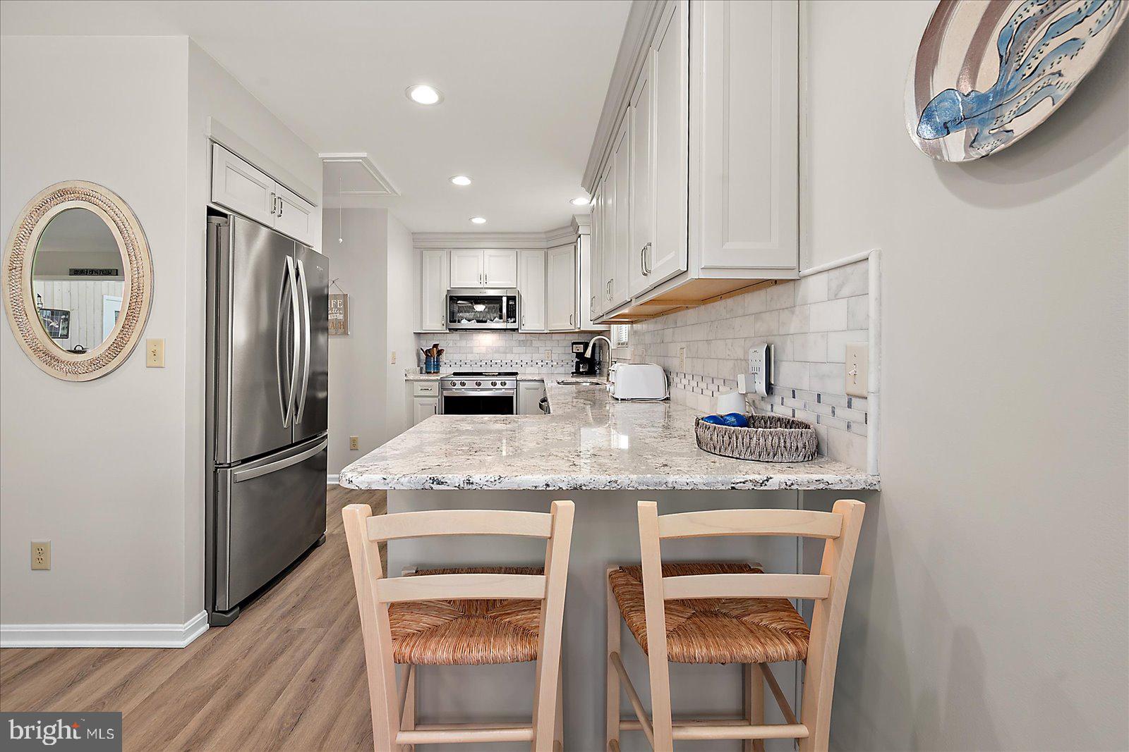 10362 Keyser Point Road Ocean City, MD 21842 - Photo 23 of 51 Modern kitchen with sleek finishes.